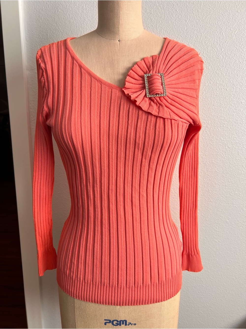 Coral Off-the-Shoulder Ribbed Sweater with Rhinestone Buckle
